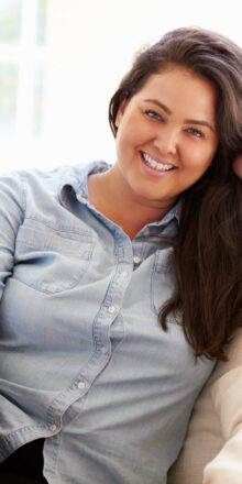 Portrait,Of,Overweight,Woman,Sitting,On,Sofa Portrait,Of,Overweight,Woman,Sitting,On,Sofa